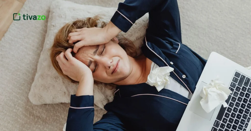 Girl with her hand on her forehead, showing signs of emotional and mental stress among different types of stress