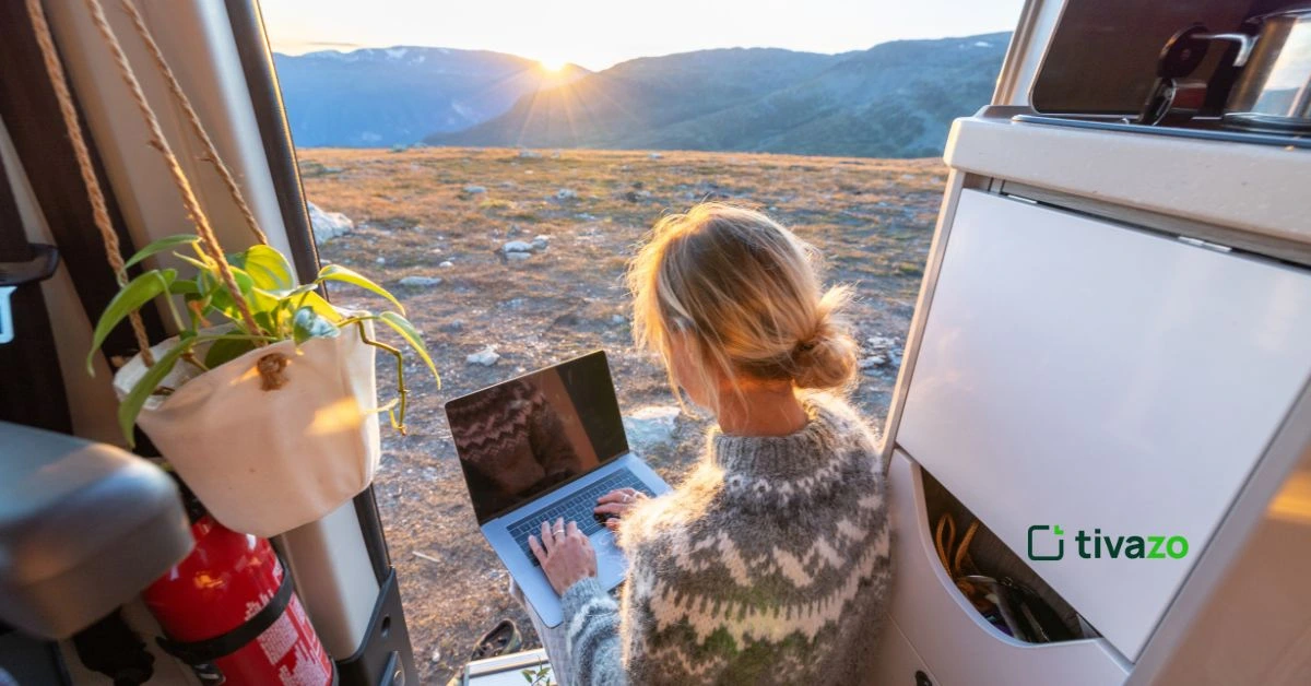 a girl working in a laptop and find methods of improving staff morale in workplace